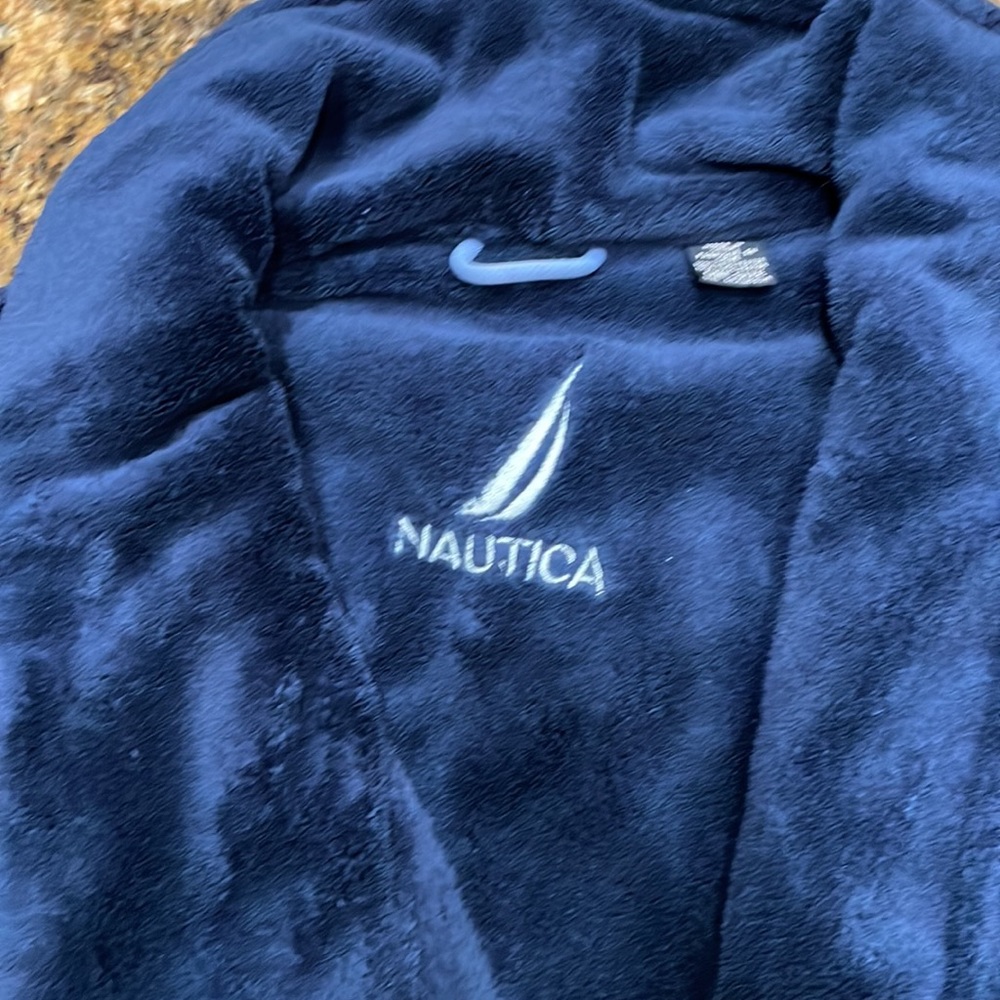 Men’s navy plush robe with two pockets and matching belt. Never worn